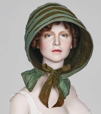 Lot 104 - A rare green silk poke bonnet/calash, circa 1806