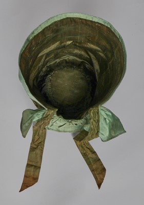Lot 104 - A rare green silk poke bonnet/calash, circa 1806