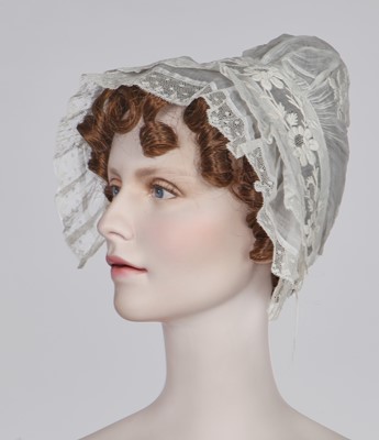 Lot 104 - A rare green silk poke bonnet/calash, circa 1806