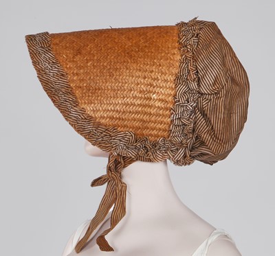 Lot 107 - A rare woven wood and striped cotton bonnet, circa 1806