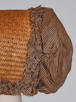 Lot 107 - A rare woven wood and striped cotton bonnet, circa 1806