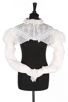 Lot 379 - A whiteworked muslin spencer bodice, 1810-20,...