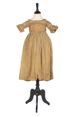 Lot 382 - A striped satin girl's dress, late 1830s, with...