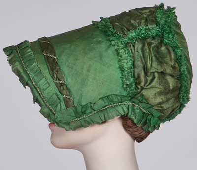 Lot 58 - A green silk bonnet, 1806-1809