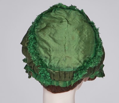 Lot 58 - A green silk bonnet, 1806-1809