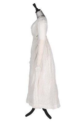 Lot 401 - An embroidered sprigged muslin dress, 1810-15,...