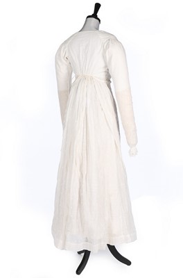 Lot 401 - An embroidered sprigged muslin dress, 1810-15,...