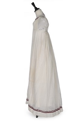 Lot 402 - A muslin dress, 1800-10, empire-line with...