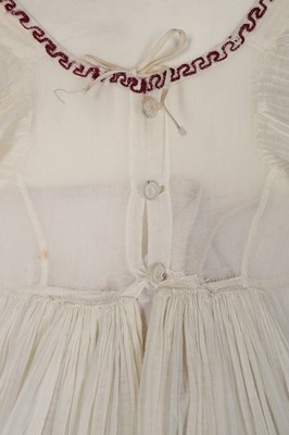 Lot 402 - A muslin dress, 1800-10, empire-line with...