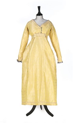 Lot 405 - A brocaded yellow changeable silk taffeta gown,...