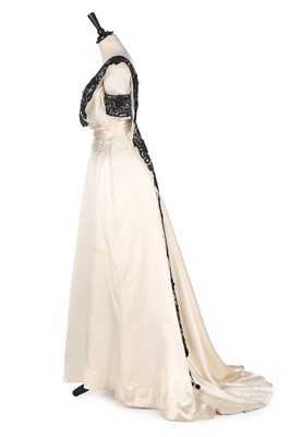 Lot 410 - An E & J Hooper ivory satin gown, circa 1912,...