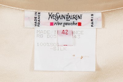 Lot 576 - Mary Quant's Yves Saint Laurent ivory blouses, mainly 1980s