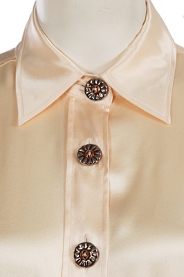 Lot 576 - Mary Quant's Yves Saint Laurent ivory blouses, mainly 1980s