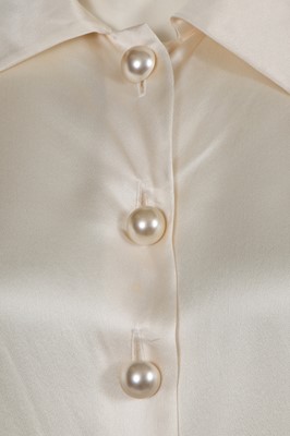 Lot 576 - Mary Quant's Yves Saint Laurent ivory blouses, mainly 1980s