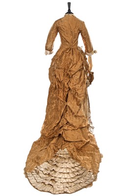Lot 488 - An ecru silk bridal gown, American, circa 1885