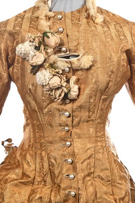 Lot 488 - An ecru silk bridal gown, American, circa 1885