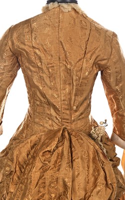 Lot 488 - An ecru silk bridal gown, American, circa 1885