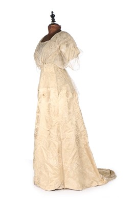 Lot 423 - An ivory silk lace bridal gown, circa 1914 and...