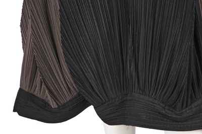 Lot 290 - An Issey Miyake grey and black pleated polyester dress, Autumn-Winter 1990-91