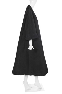 Lot 432 - A Christian Dior haute couture black silk swagger coat, Autumn-Winter 1952-53