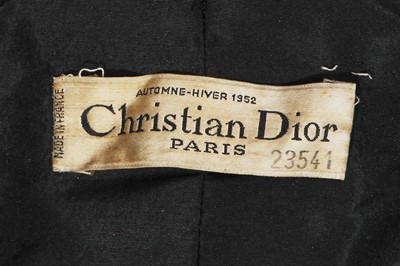 Lot 432 - A Christian Dior haute couture black silk swagger coat, Autumn-Winter 1952-53