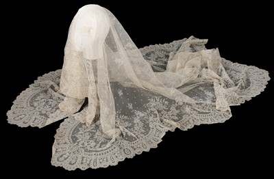 Lot 504 - A net on net lace veil, late 19th century, the...