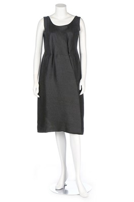 Lot 174 - A Balenciaga couture black slubbed-silk dress,...