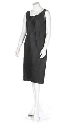 Lot 174 - A Balenciaga couture black slubbed-silk dress,...