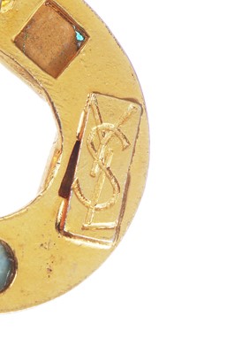 Lot 529 - Three Yves Saint Laurent gilt brooches, 1970s