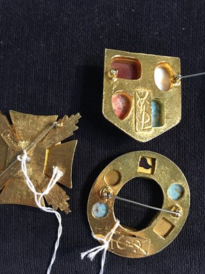 Lot 529 - Three Yves Saint Laurent gilt brooches, 1970s