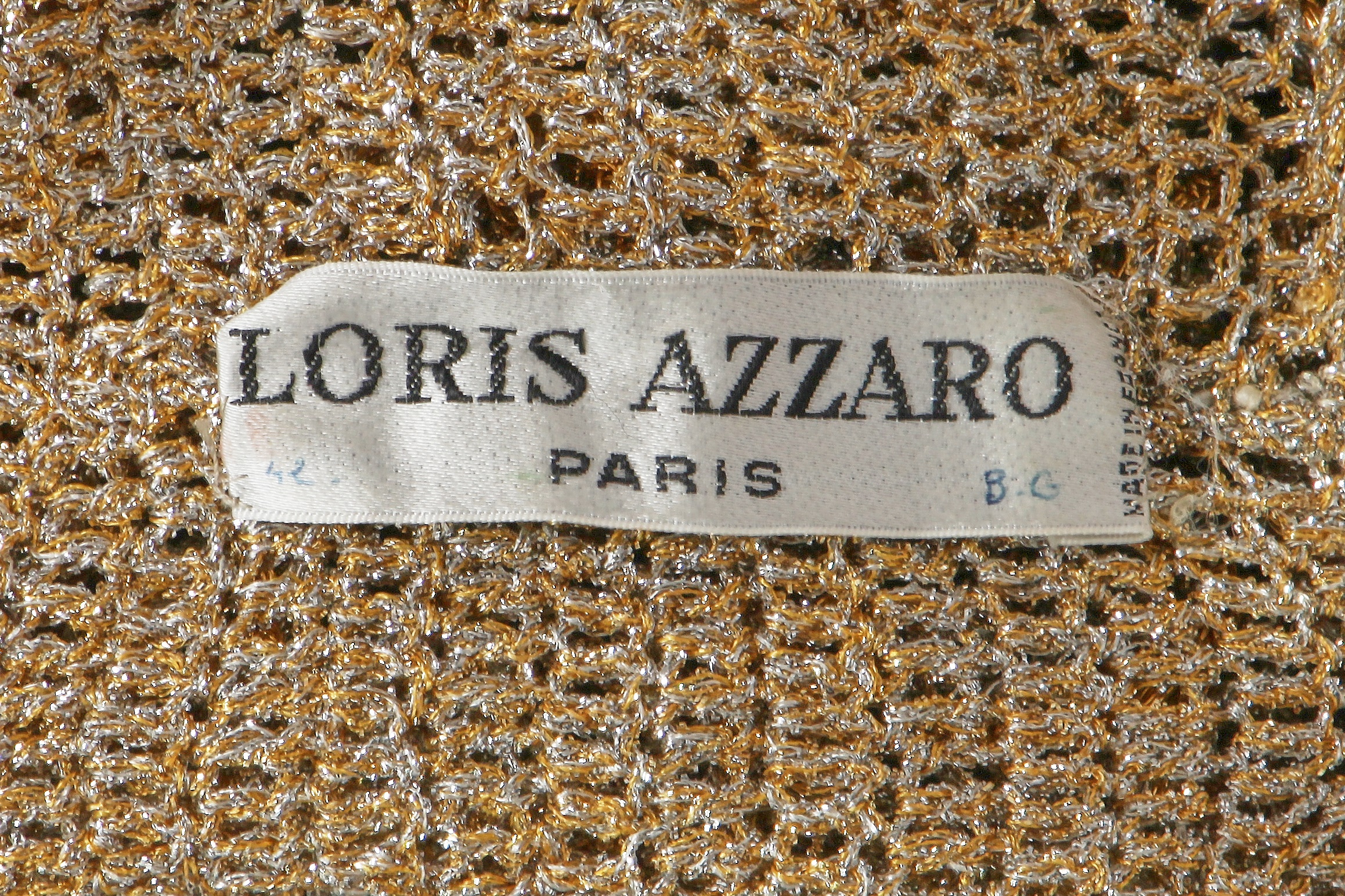Lot 514 - A Loris Azzaro beaded gold and silver lurex