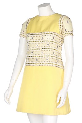 Lot 69 - A Torrente couture yellow worsted mini-dress,...