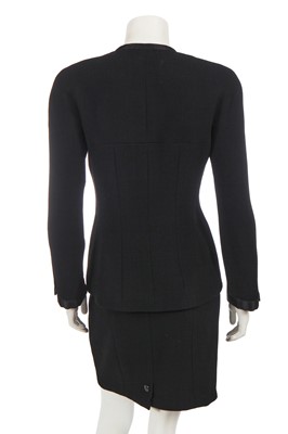Lot 164 - A Chanel by Karl Lagerfeld black wool crêpe suit, Cruise collection 1996