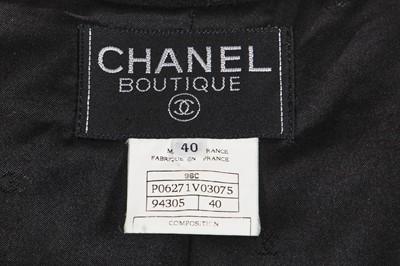 Lot 164 - A Chanel by Karl Lagerfeld black wool crêpe suit, Cruise collection 1996