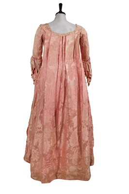 Lot 884 - A pale pink damask robe à la Française, the fabric 1740s, the construction 1765-75