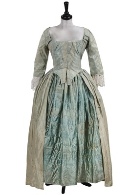Lot 881 - A pale blue striped silk robe à l'Anglaise and petticoat, circa 1775