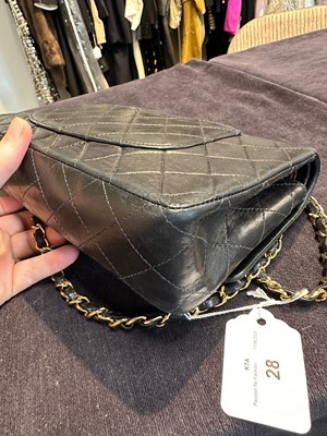 Lot 28 - A Chanel quilted navy blue lambskin leather Classic double flap bag, 2000-2002