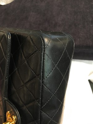 Lot 28 - A Chanel quilted navy blue lambskin leather Classic double flap bag, 2000-2002