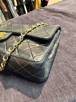 Lot 28 - A Chanel quilted navy blue lambskin leather Classic double flap bag, 2000-2002