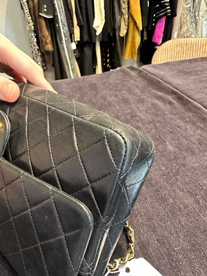 Lot 28 - A Chanel quilted navy blue lambskin leather Classic double flap bag, 2000-2002