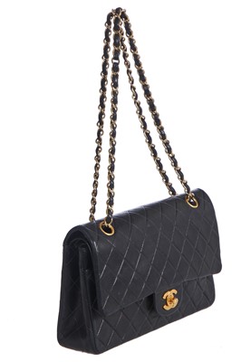 Lot 28 - A Chanel quilted navy blue lambskin leather Classic double flap bag, 2000-2002