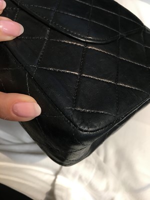 Lot 28 - A Chanel quilted navy blue lambskin leather Classic double flap bag, 2000-2002
