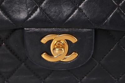 Lot 28 - A Chanel quilted navy blue lambskin leather Classic double flap bag, 2000-2002