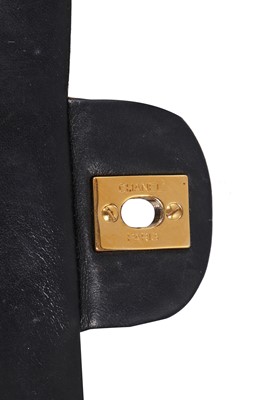 Lot 28 - A Chanel quilted navy blue lambskin leather Classic double flap bag, 2000-2002
