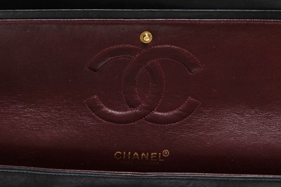 Lot 28 - A Chanel quilted navy blue lambskin leather Classic double flap bag, 2000-2002