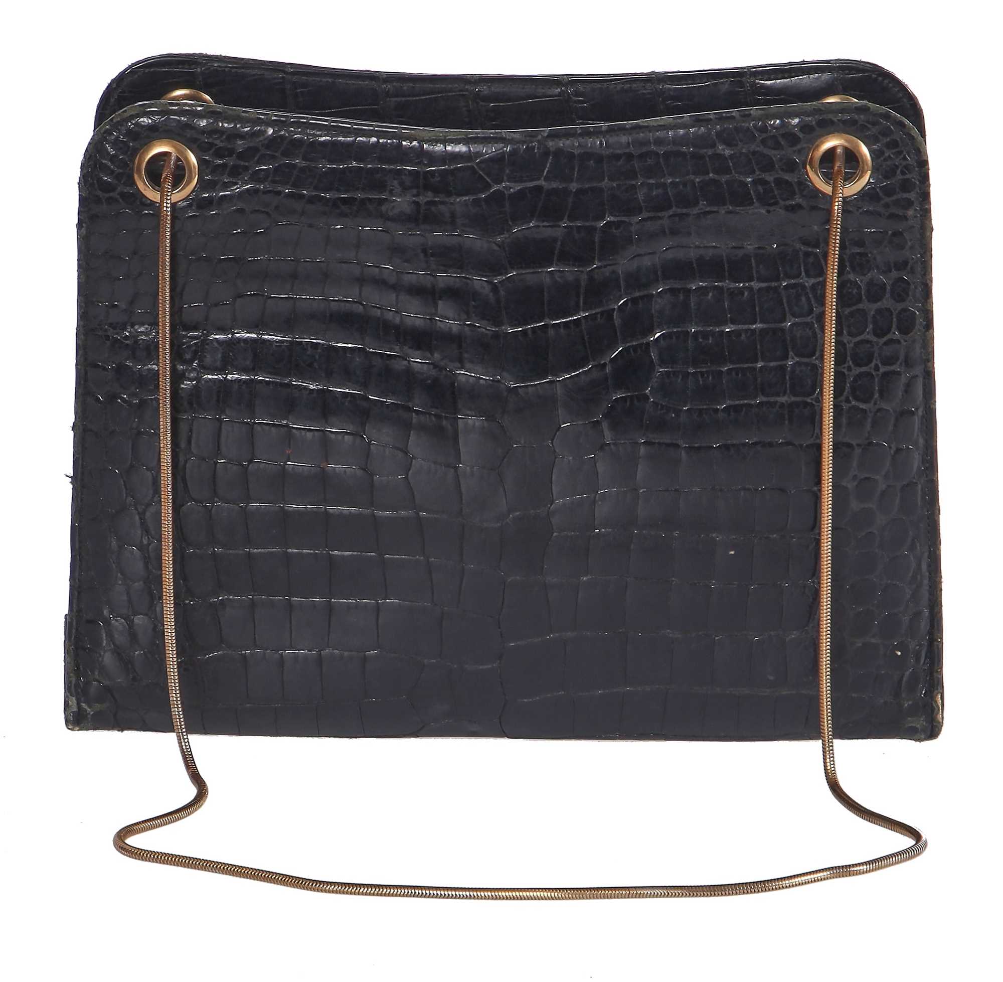 Lot 45 - A Cartier black crocodile handbag, 1959
