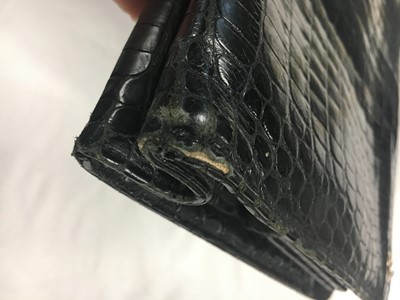 Lot 45 - A Cartier black crocodile handbag, 1959