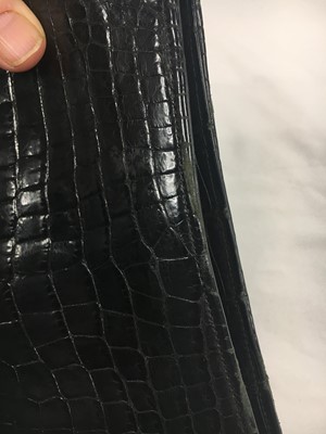 Lot 45 - A Cartier black crocodile handbag, 1959