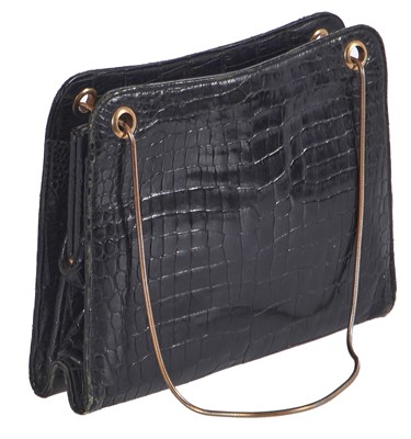 Lot 45 - A Cartier black crocodile handbag, 1959