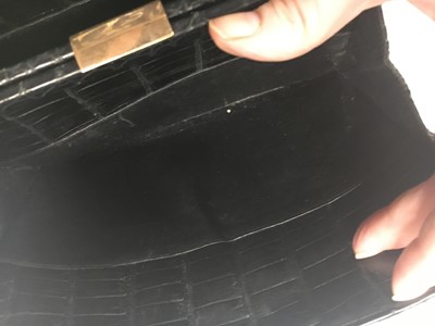 Lot 45 - A Cartier black crocodile handbag, 1959